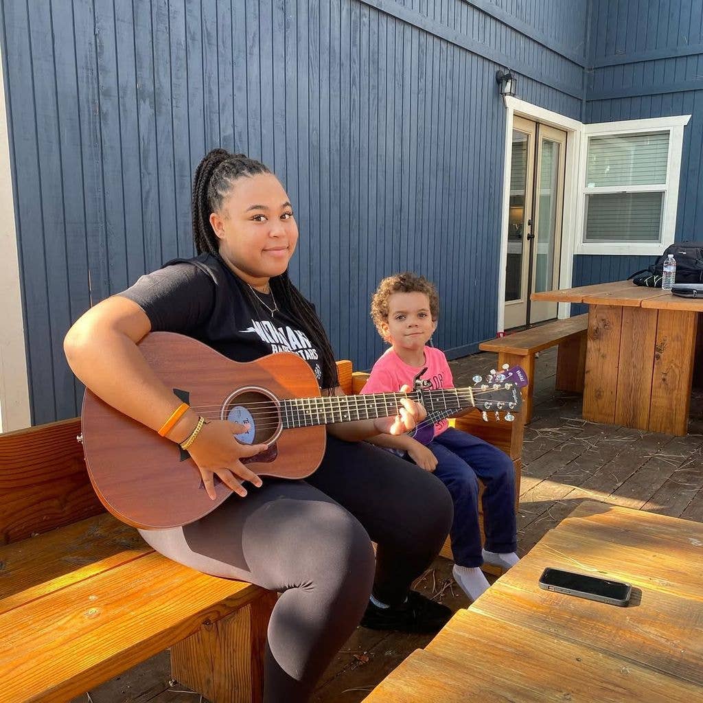 Amara Lawrence loves playing the guitar