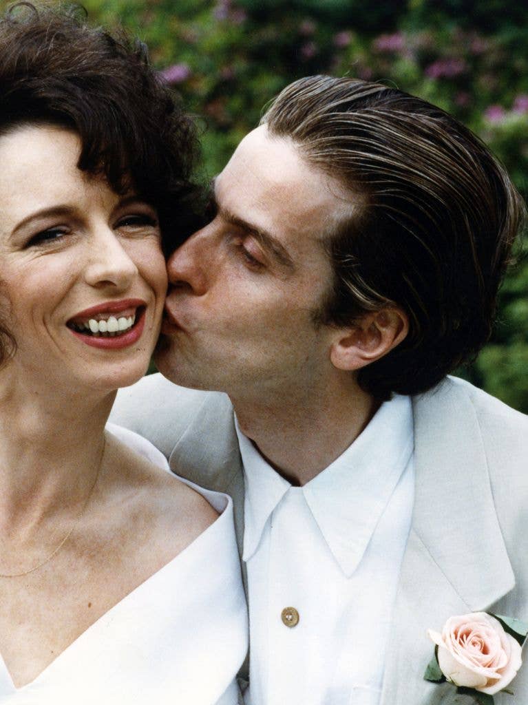 Actor Peter Capaldi kissing Elaine Collins on their wedding day