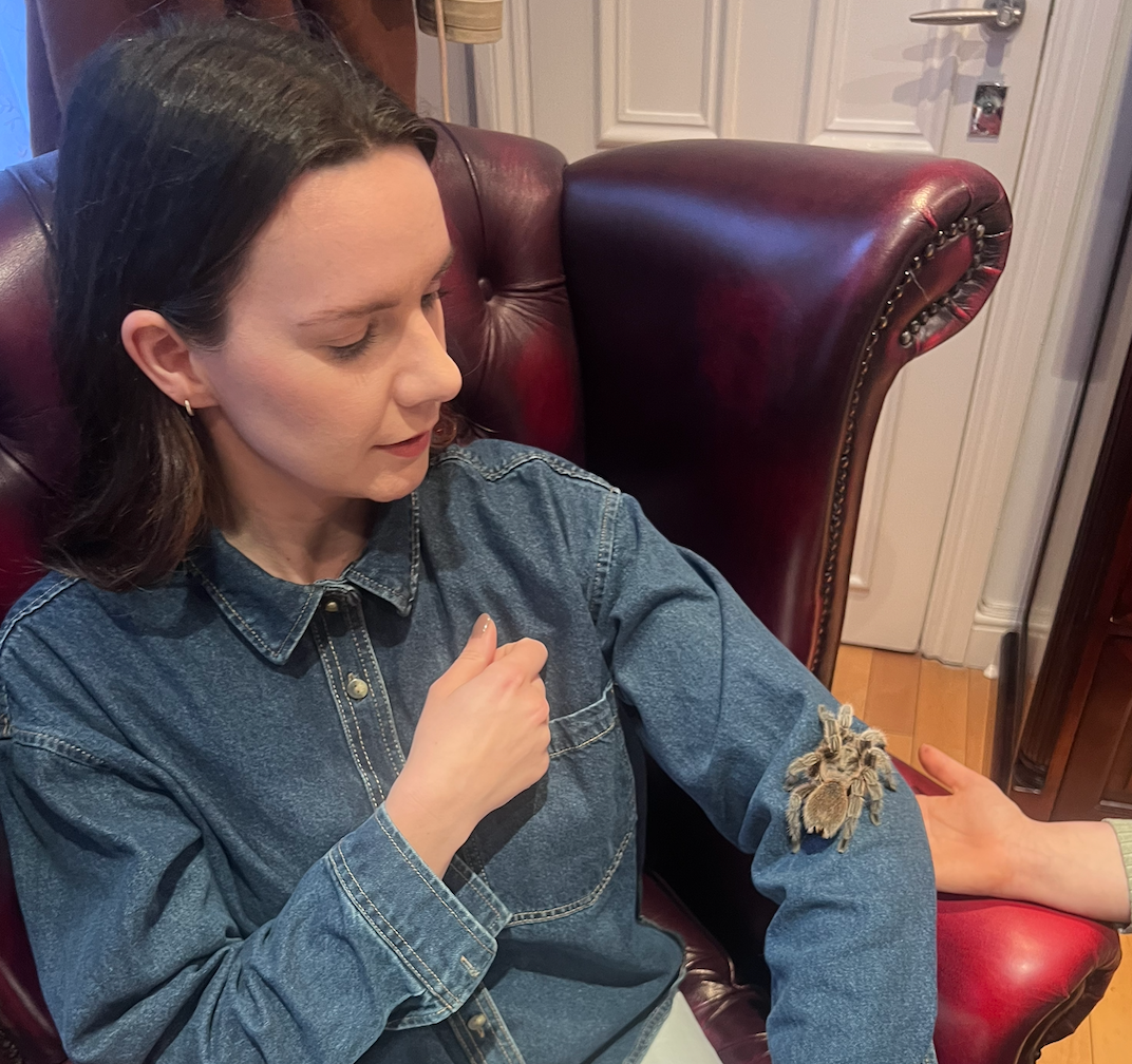 woman with tarantula on arm