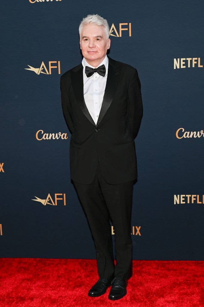 Mike had walked the red carpet without the prosthetics, looking suave in a classic black suit