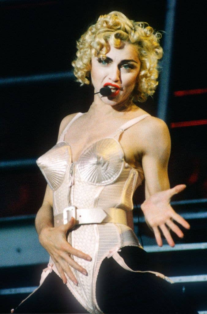 Madonna: Blonde Ambition Tour. She is wearing a Jean Paul Gaultier conical bra corset