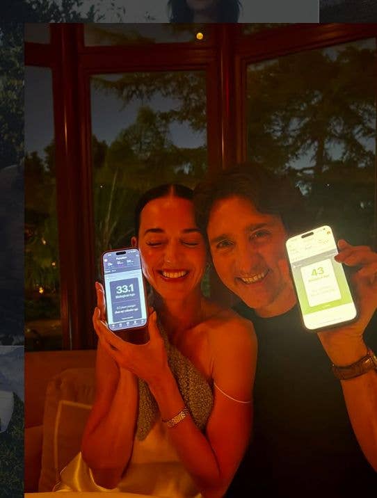 Katy Perry and Justin Trudeau holding up their phones
