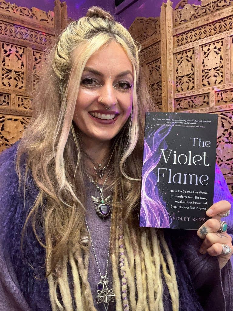 If you’re curious about exploring the violet flame for yourself, Violet's book is a great place to start. Here she is holding up a copy.