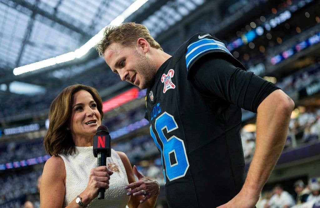 Jared Goff #16 of the Detroit Lions is interviewed by Dianna Russini on Netflix before the game against the Minnesota Vikings at U.S. Bank Stadium on December 25, 2025 in Minneapolis, Minnesota. 
