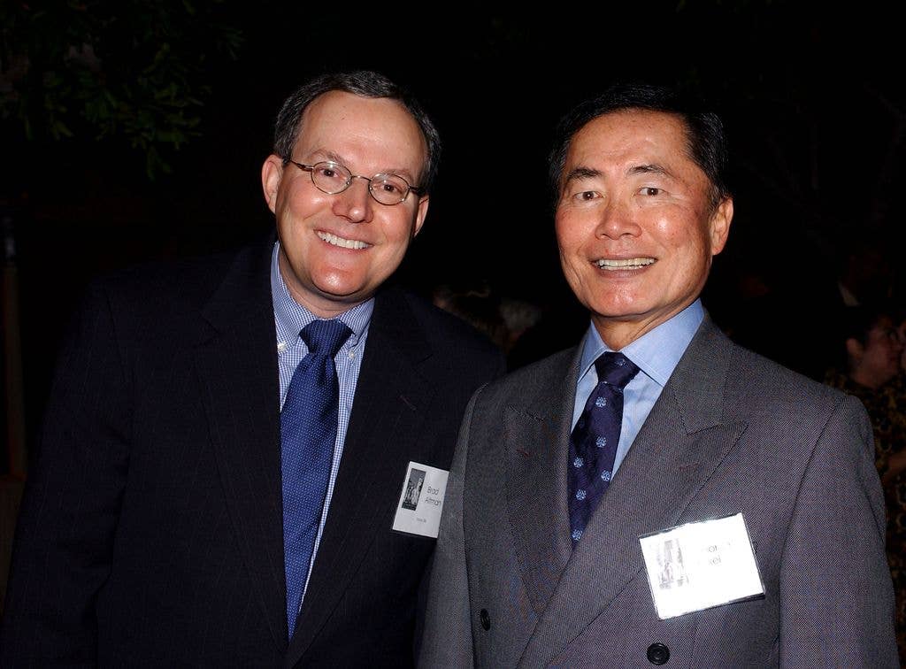 Actor George Takei (R) poses with Brad Altman at the Los Angeles Conservancy 25th Anniversary Gala at The Grill at Union Station October 11, 2003 in Los Angeles, California. 