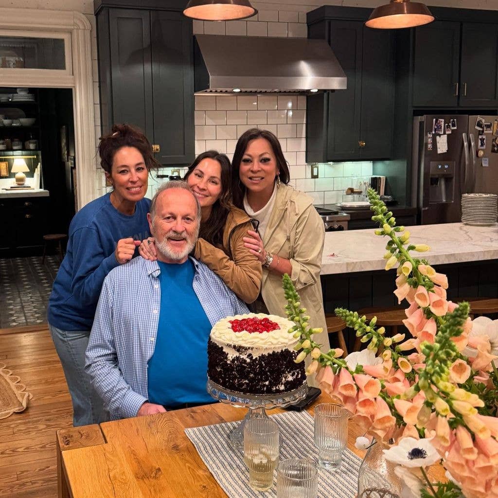 joanna gaines and dad with friends in kitchen in front of birthday cake