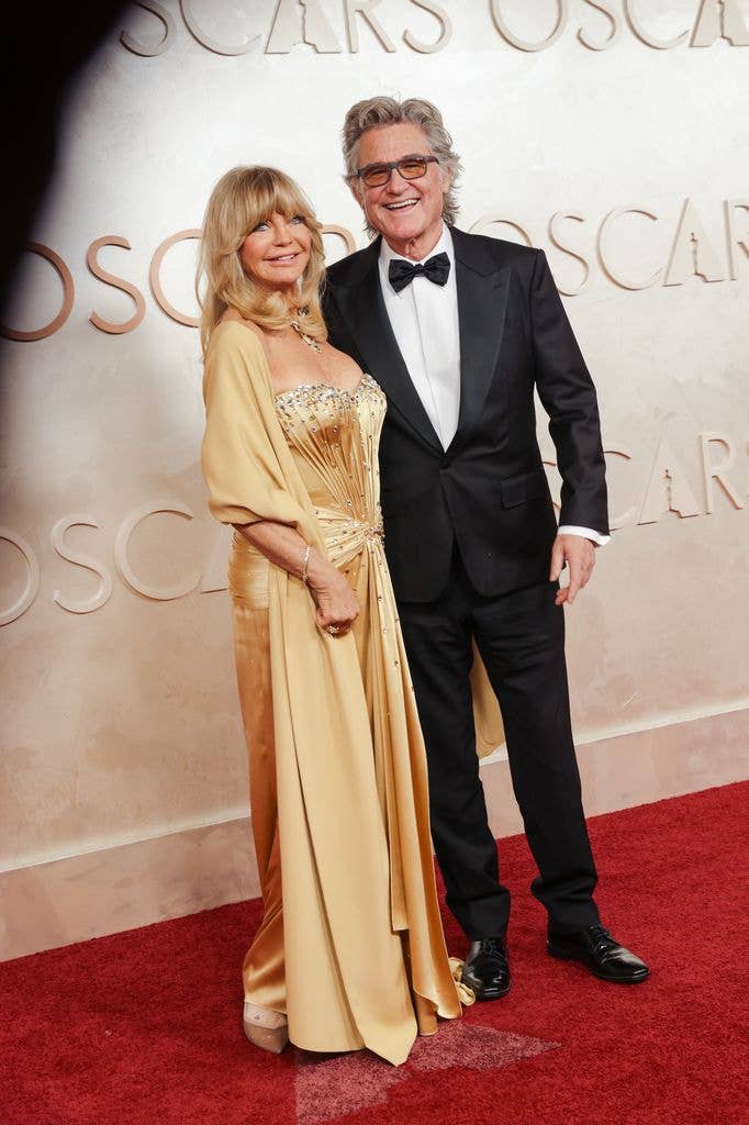 goldie hawn kurt russell gold dress black suit