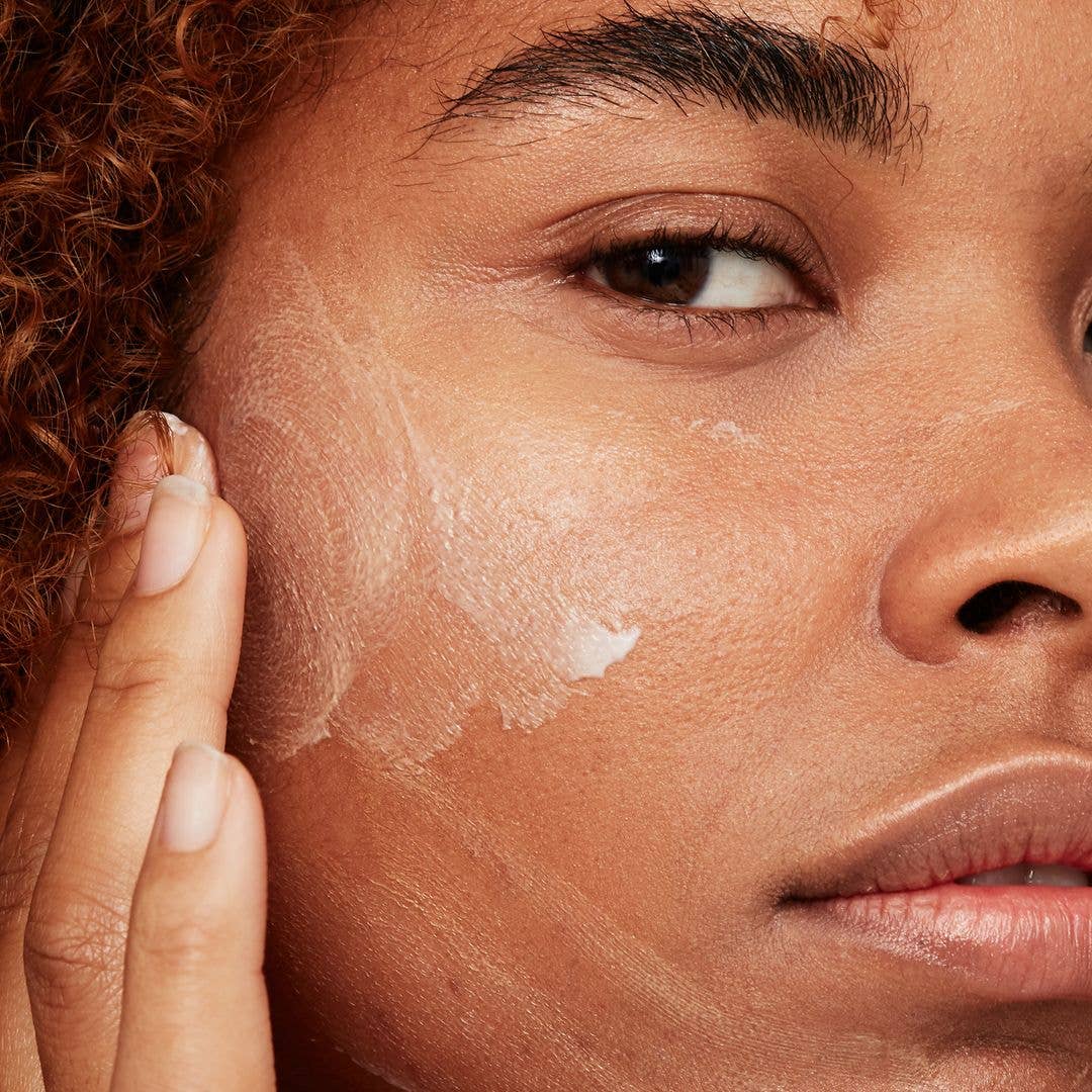 Model applying skincare