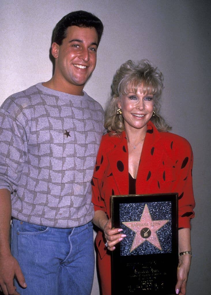 Barbara Eden holds a picture of her Hollywood Star while standing next to son Matthew Ansara.