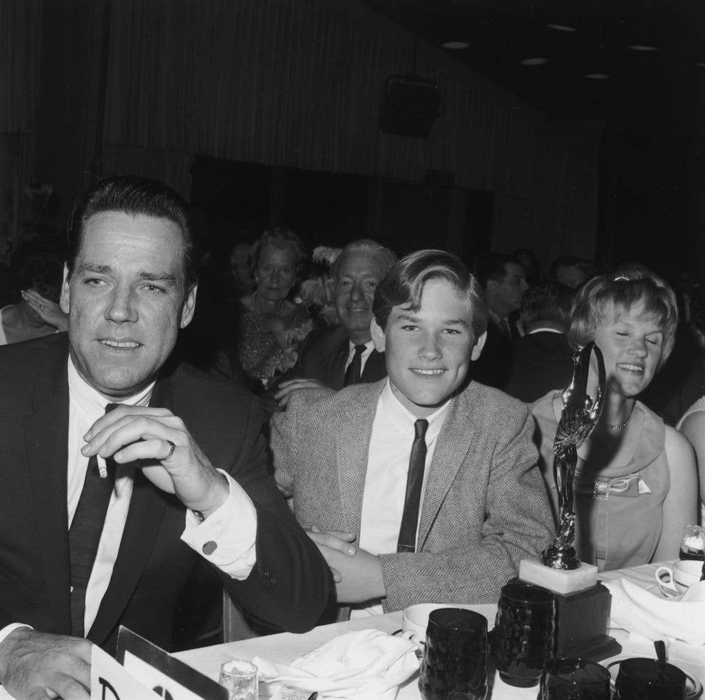 Kurt Russell (C) smiles at the Spotlighter Teen Awards dinner with his parents, Bing and Louise Russell, 1966