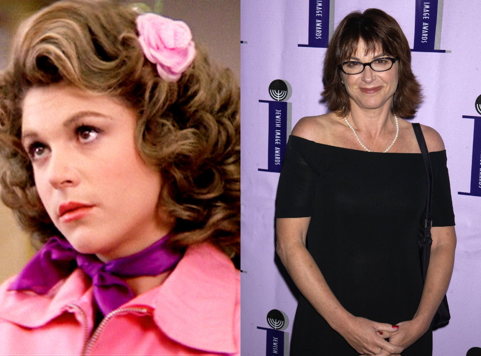 Split image of Dinah Manoff, shown on the left as Marty Maraschino   in a pink jacket and magenta scarf tied around her neck, with a pink flower clip in her short brown curly hair. On the right, shown in a more modern shot wearing a black top off the shoulder with a single bra strap showing, a pearl necklace and black rectangular glasses, holding her hands clasped in front of her.