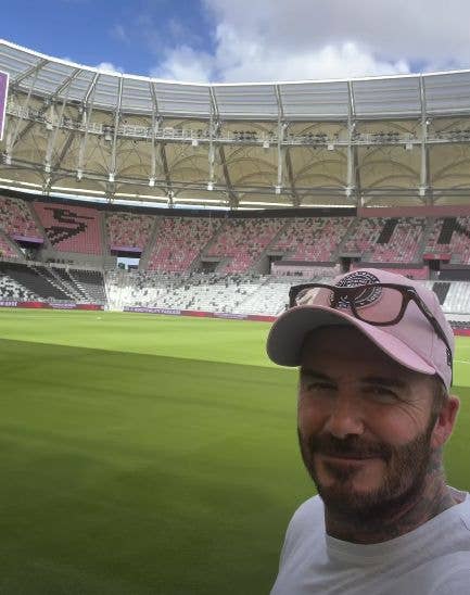 David Beckham standing on a football pitch