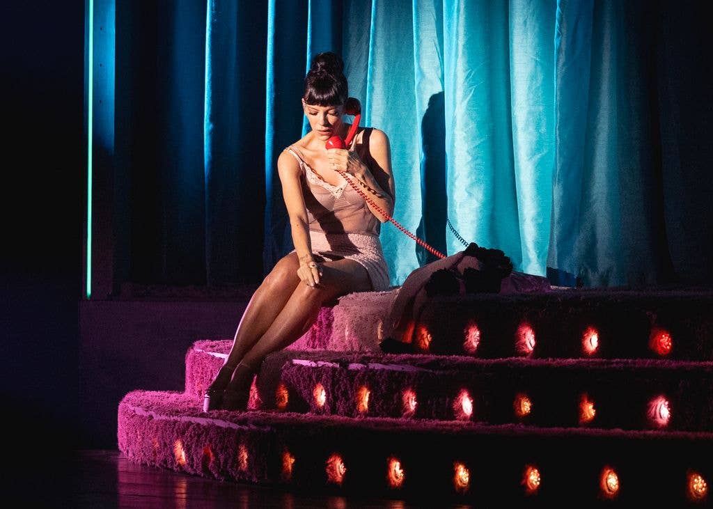 Lily in a sheer cami on stage