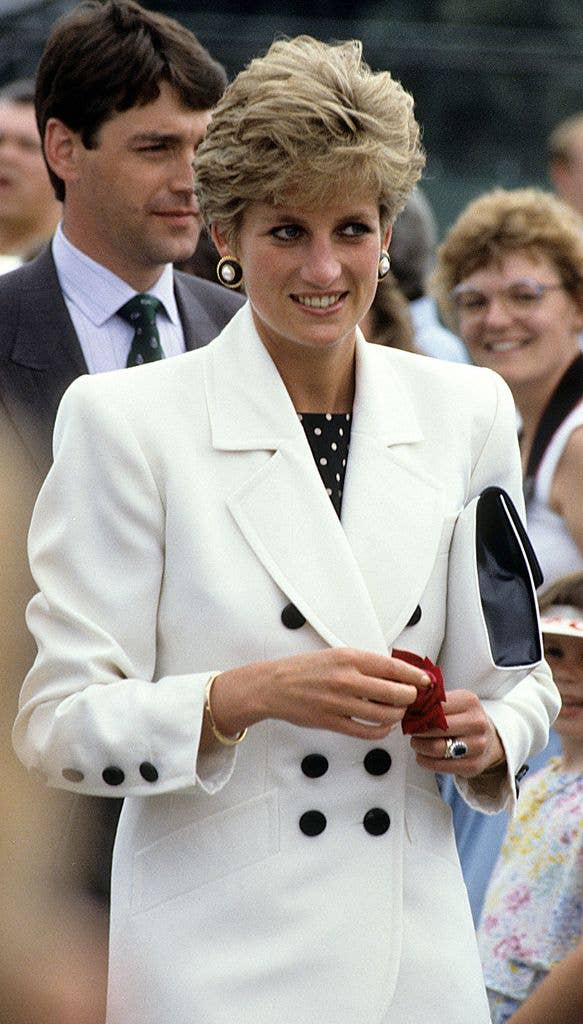 Princess Diana in a white outfit with no gloves