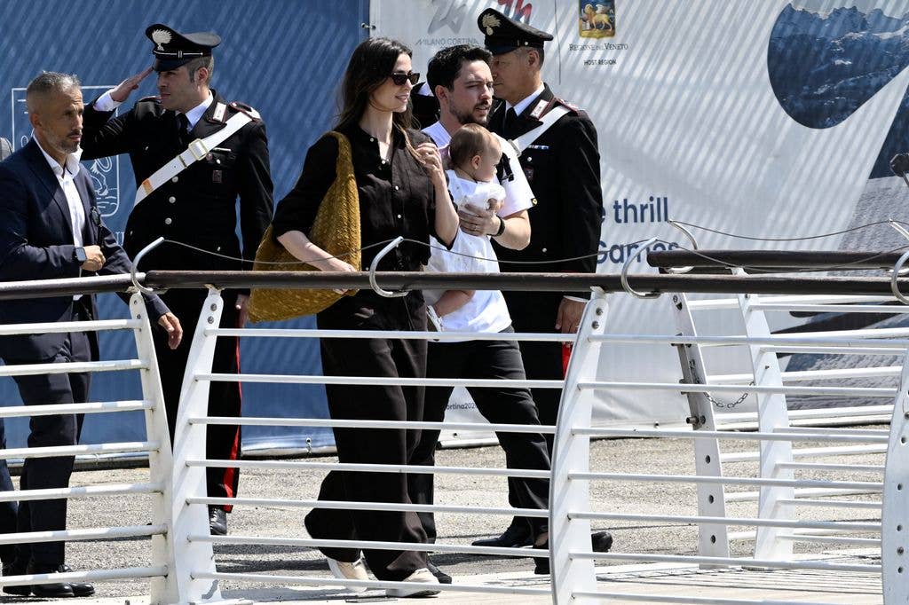 Princess Rajwa (C), Crown Prince of Jordan, Hussein bin Abdullah and their daughter Iman Bint Hussein board a taxi boat after landing at Venice Marco Polo airport