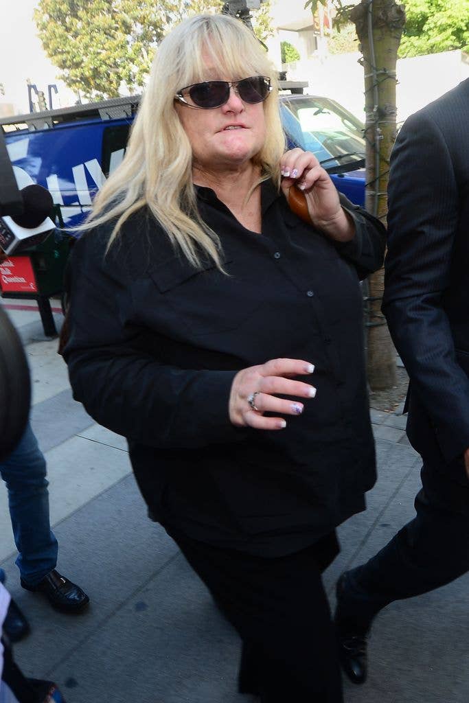 Michael Jackson's ex-wife Debbie Rowe arrives at court in Los Angeles, wearing dark trousers, a black shirt and sunglasses.
