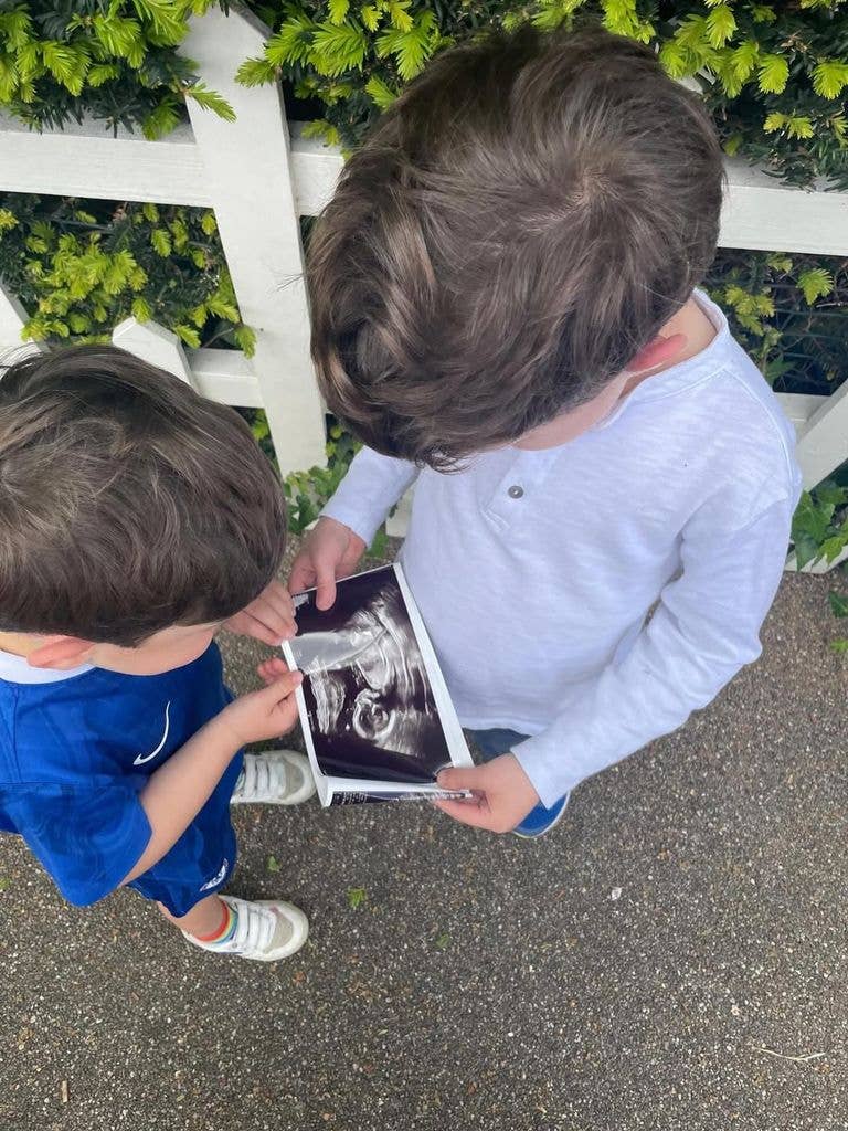 Ernest and August looking at a baby scan