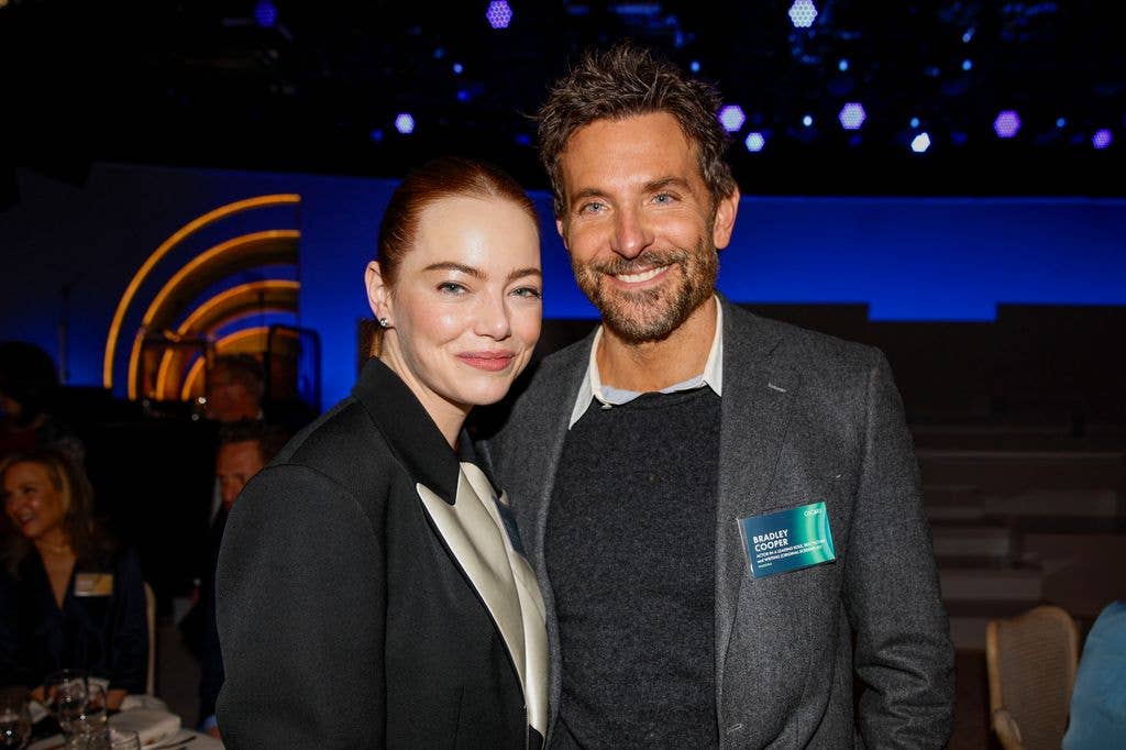 Emma Stone and Bradley Cooper at the Oscars Nominees Lunch in 2024.