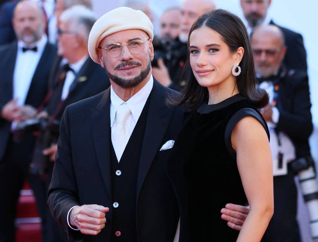 John Travolta and Ella Bleu Travolta attend the "Karma" screening during the 79th annual Cannes Film Festival at Palais des Festivals on May 15, 2026 in Cannes, France.