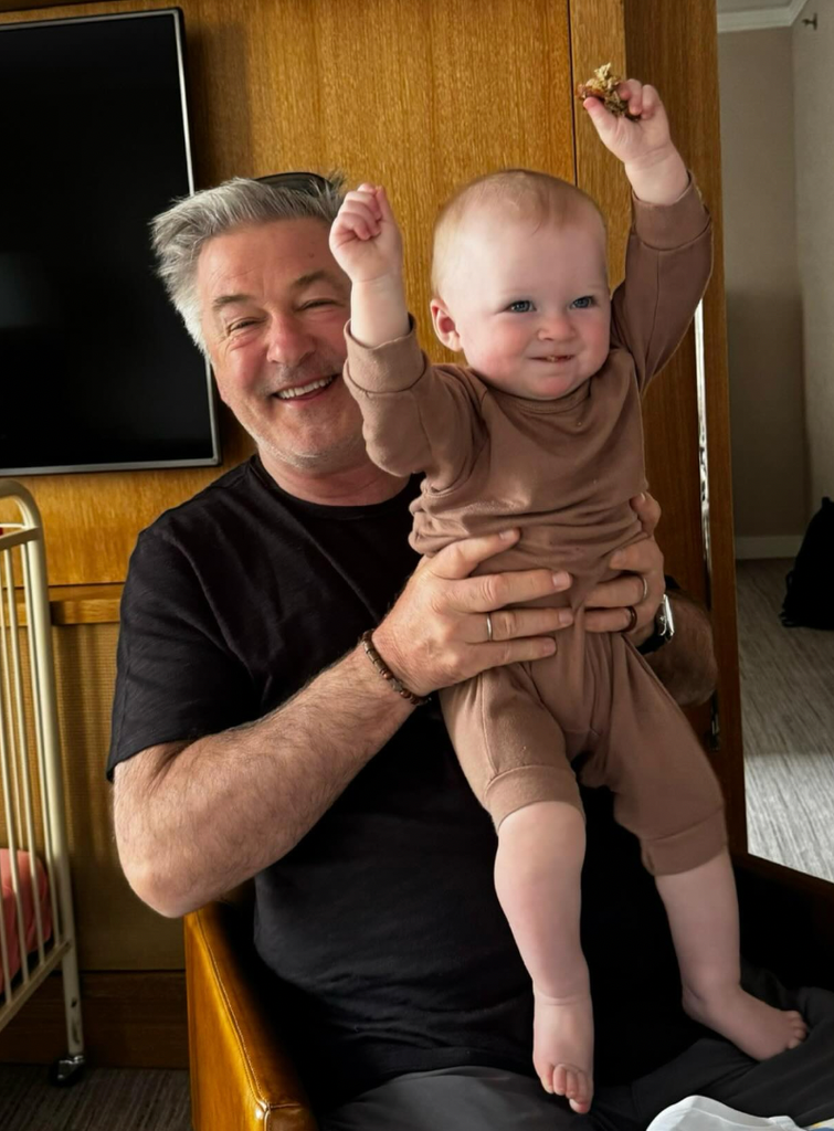 Alec Baldwin in a playful moment with his grandson, Holland