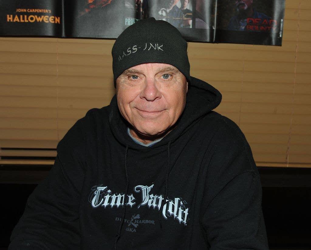 Tony Moran in a black hoodie with white text and a black beanie.