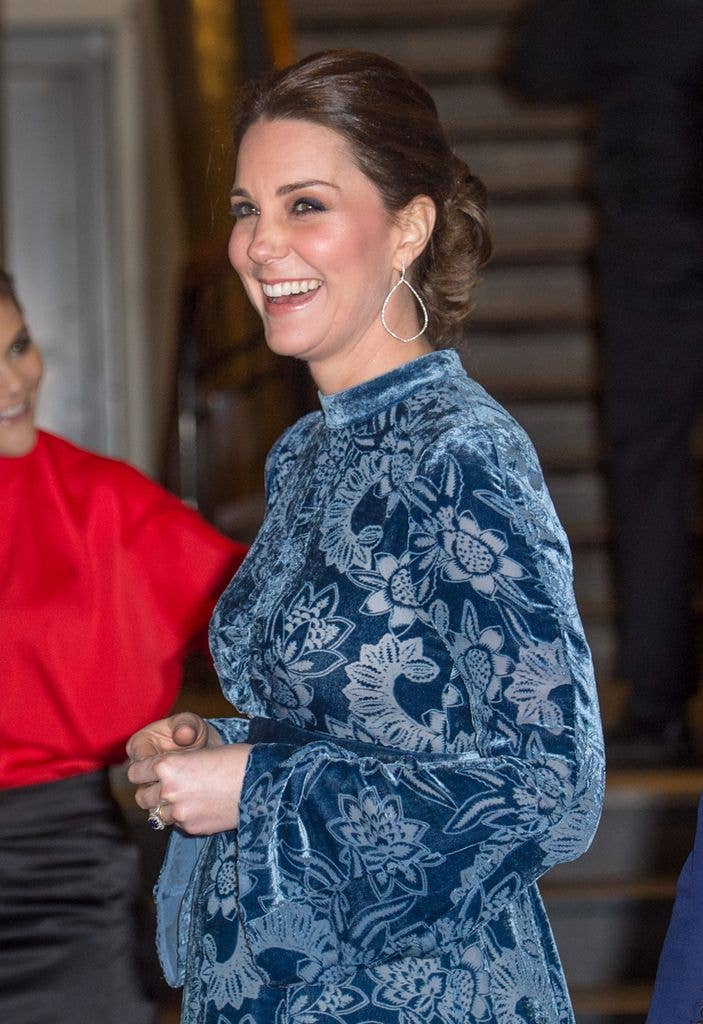 Catherine smiling in blue velvet dress