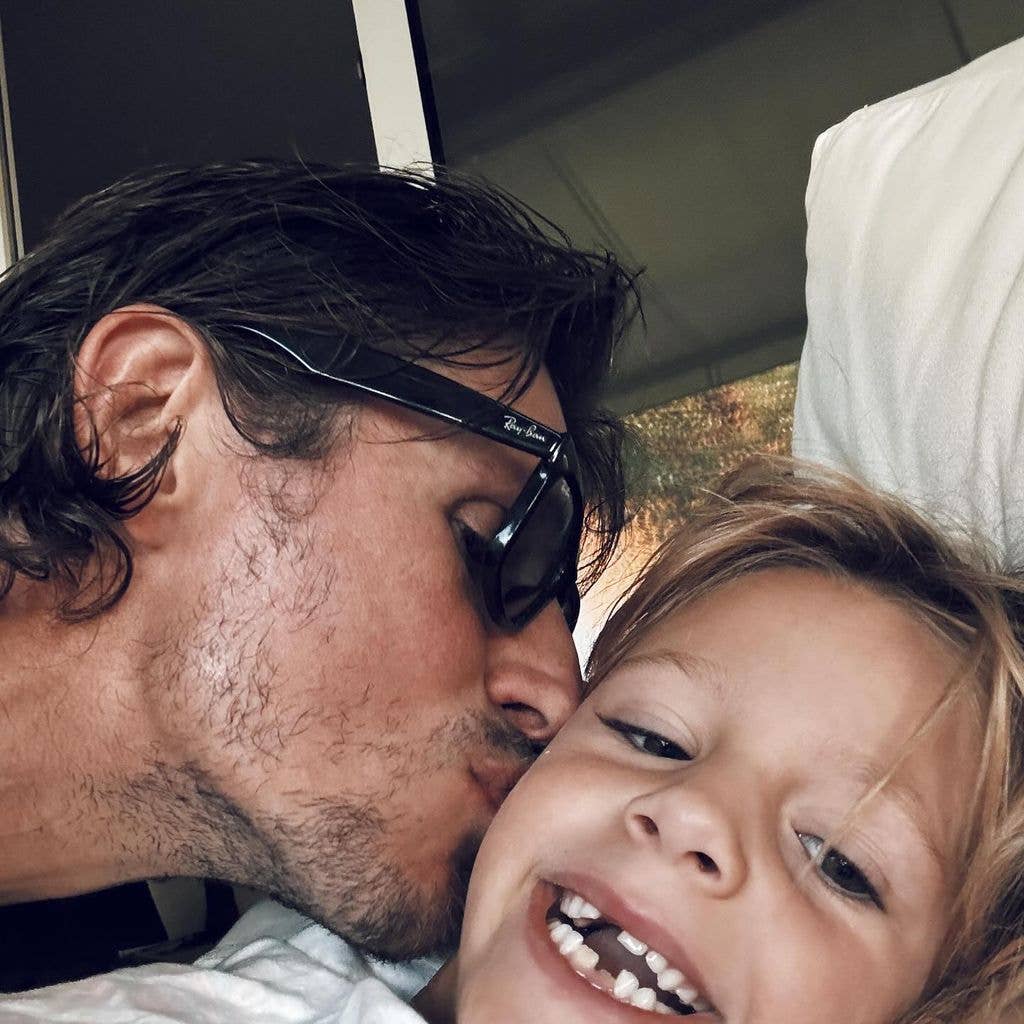 Jake kissing River on the cheek