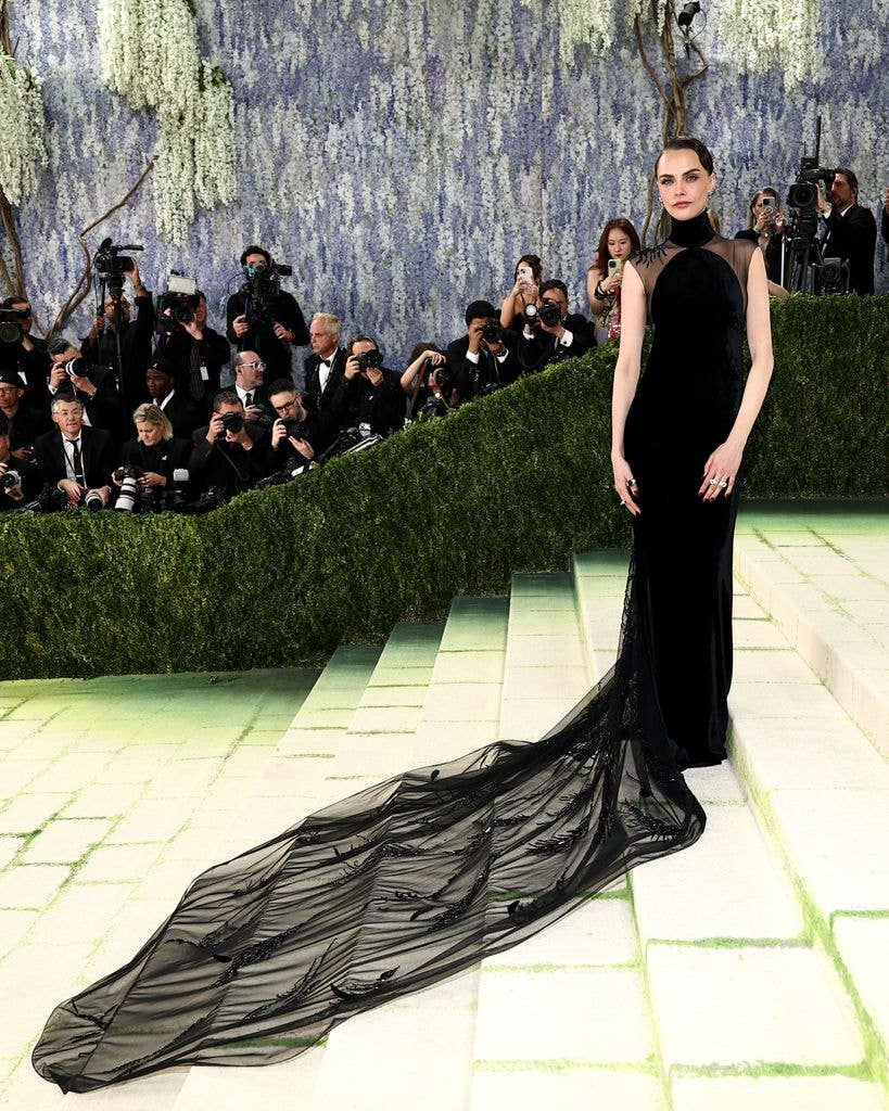 Cara Delevingne in a black long dress in the famous steps