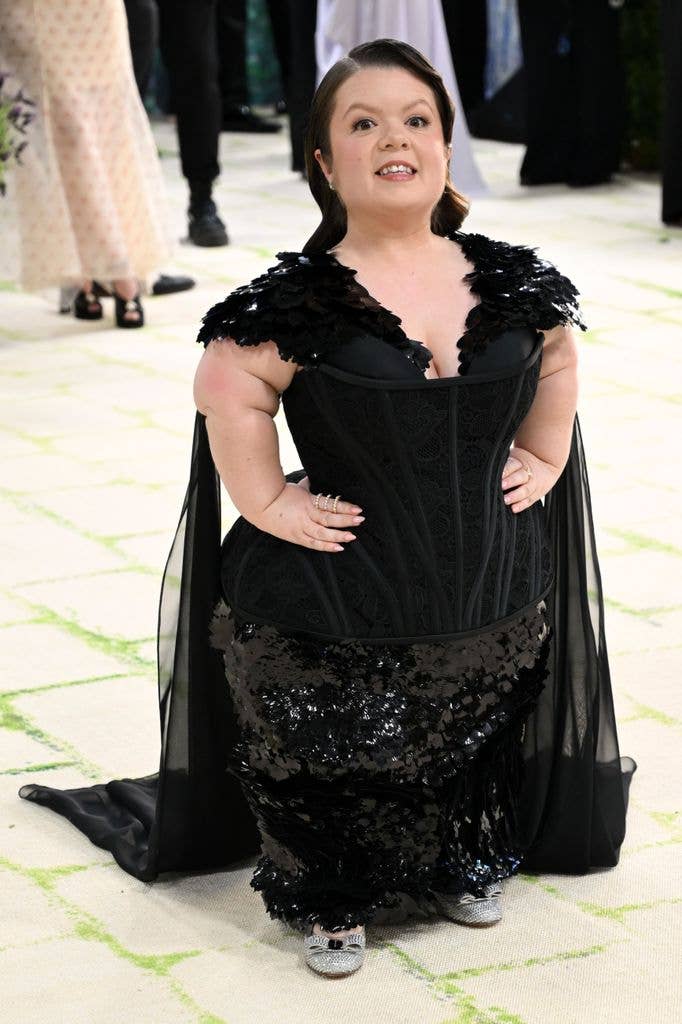 Sinead Burke opted for a black gown with sequin detail and mesh cape 