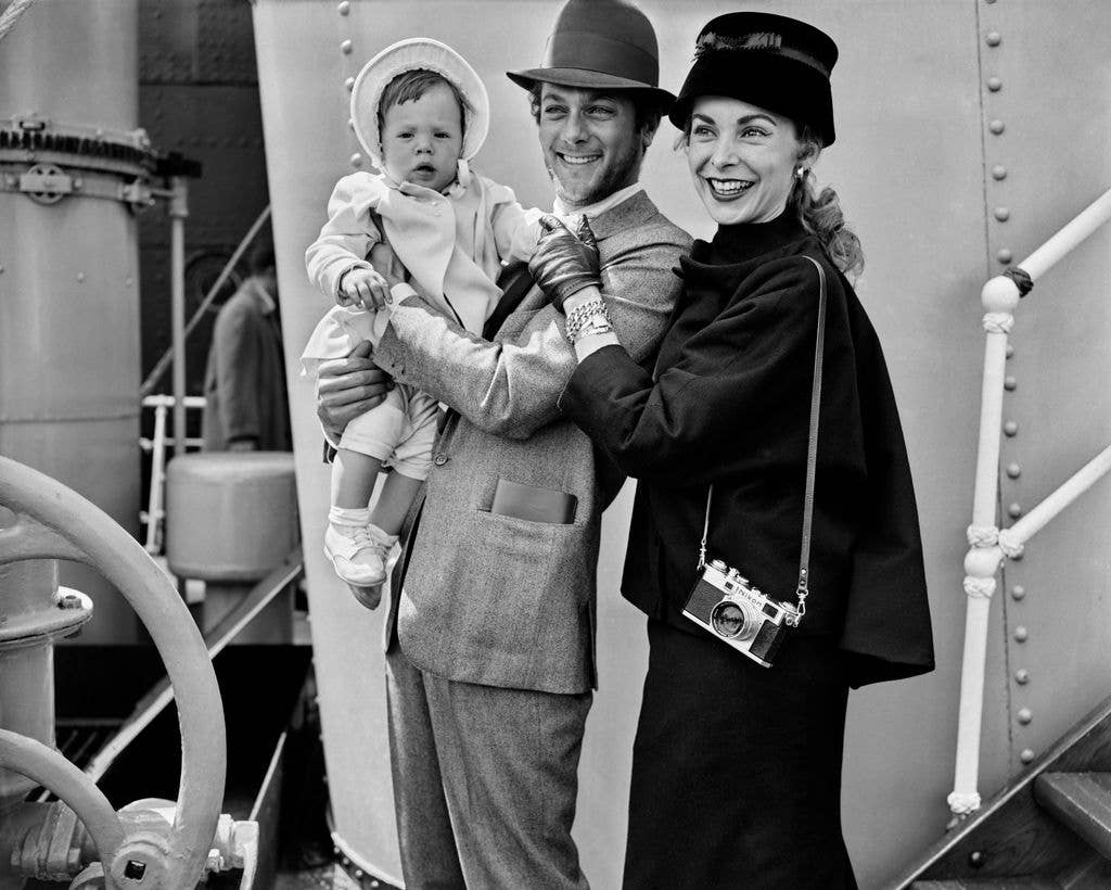 American actor Tony Curtis (1925 - 2010), his wife Janet Leigh (1927 - 2004) and their baby daughter Kelly arriving at Southampton for a visit to England, May 25th 1957