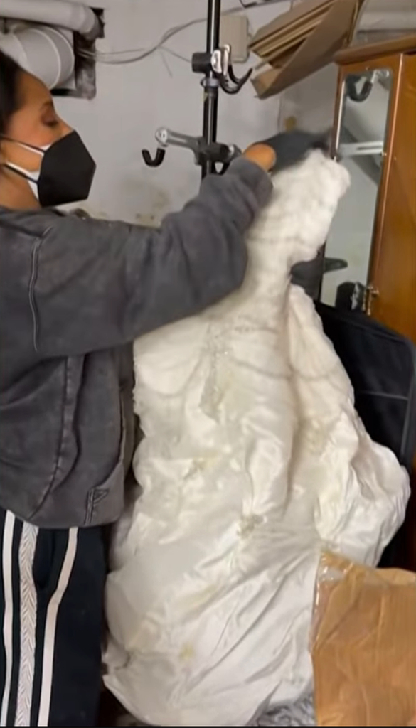 Still shared on TODAY with Jenna & Sheinelle Thursday, May 14, 2026 of her pulling out her wedding dress during her move