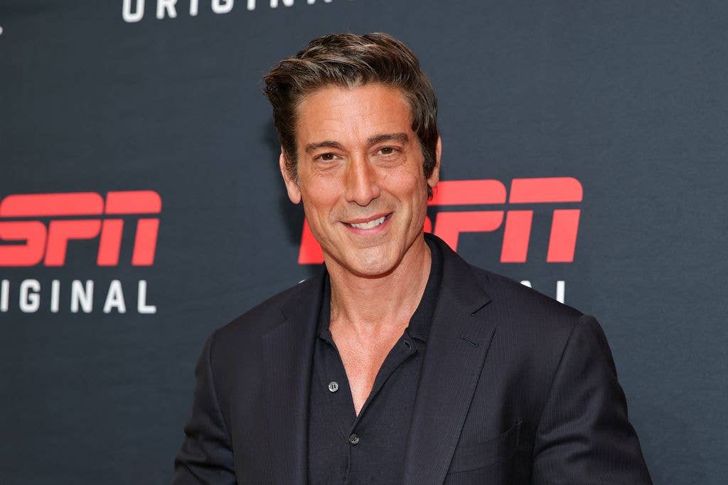 David attended the ESPN event solo smiling