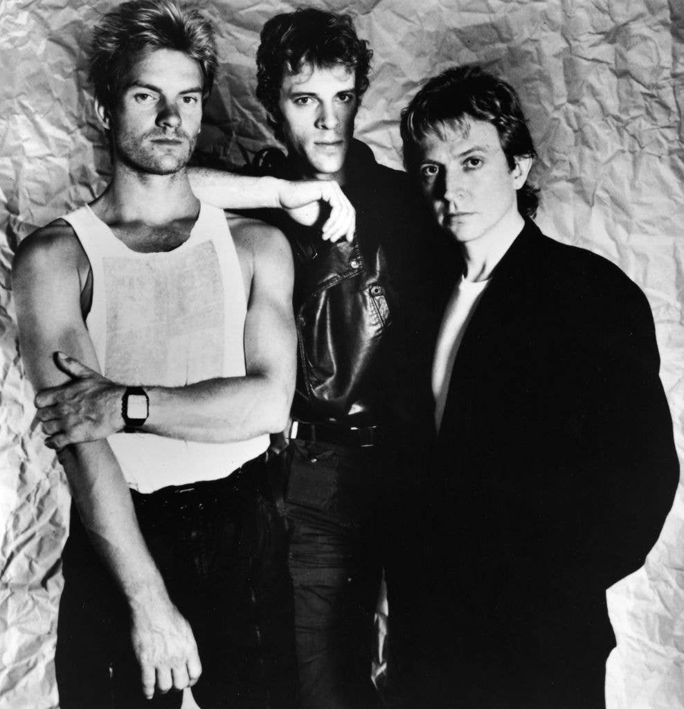 Black and white photo of the rock band The Police, with members Sting, Stewart Copeland and Andy Summers, circa 1983. 