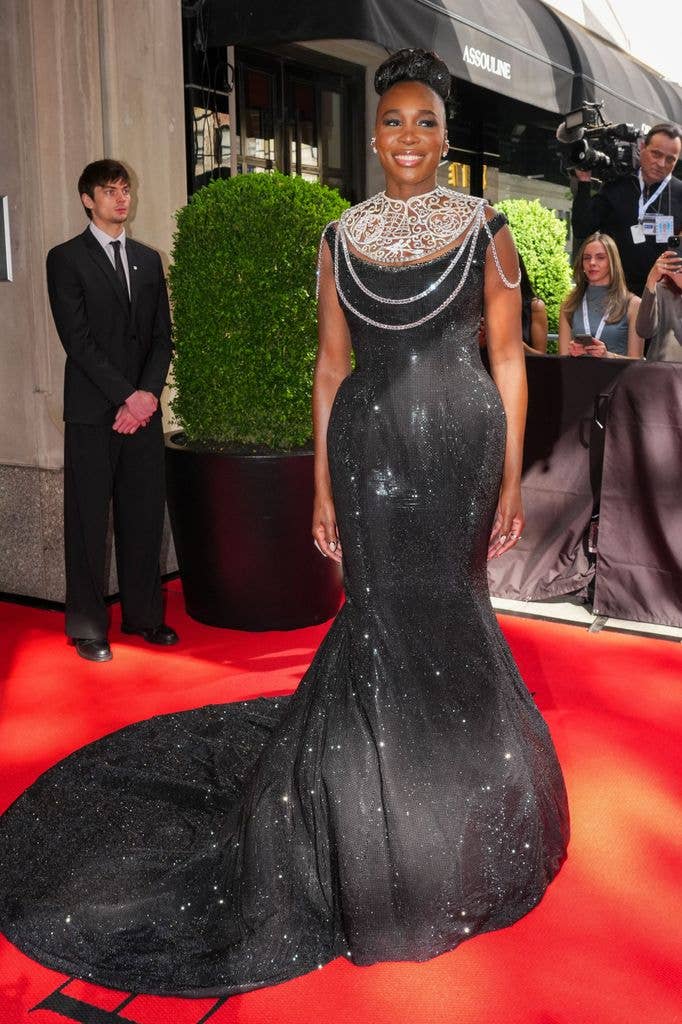 Venus Williams wears a black metallic dress with sparkling collar