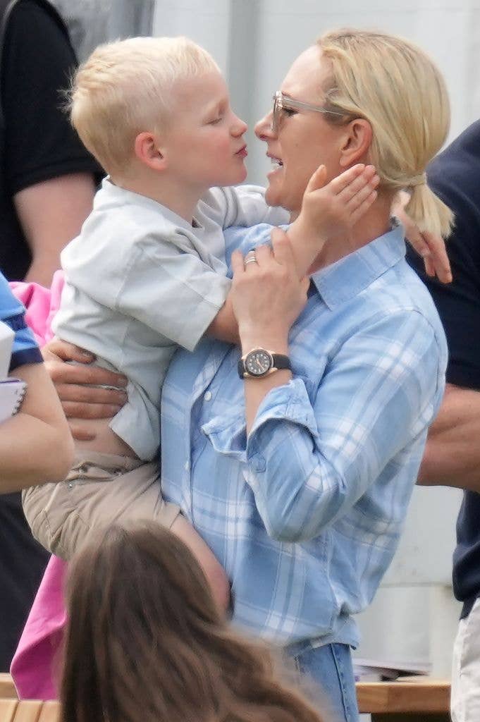 Lucas leans towards zara tindall for kiss
