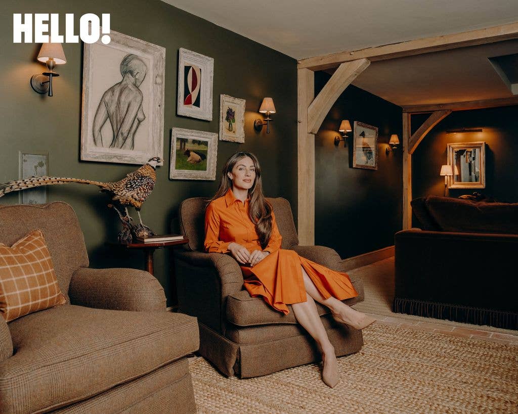 Lydia sitting on a couch in a living room
