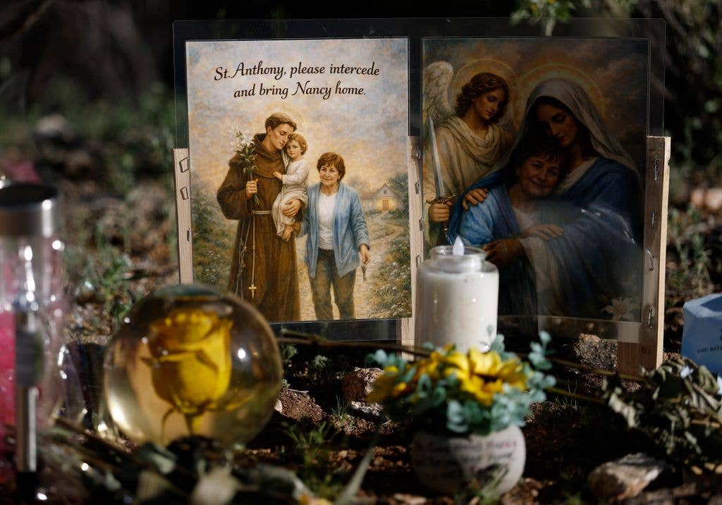 A picture is displayed in front of the home of Nancy Guthrie