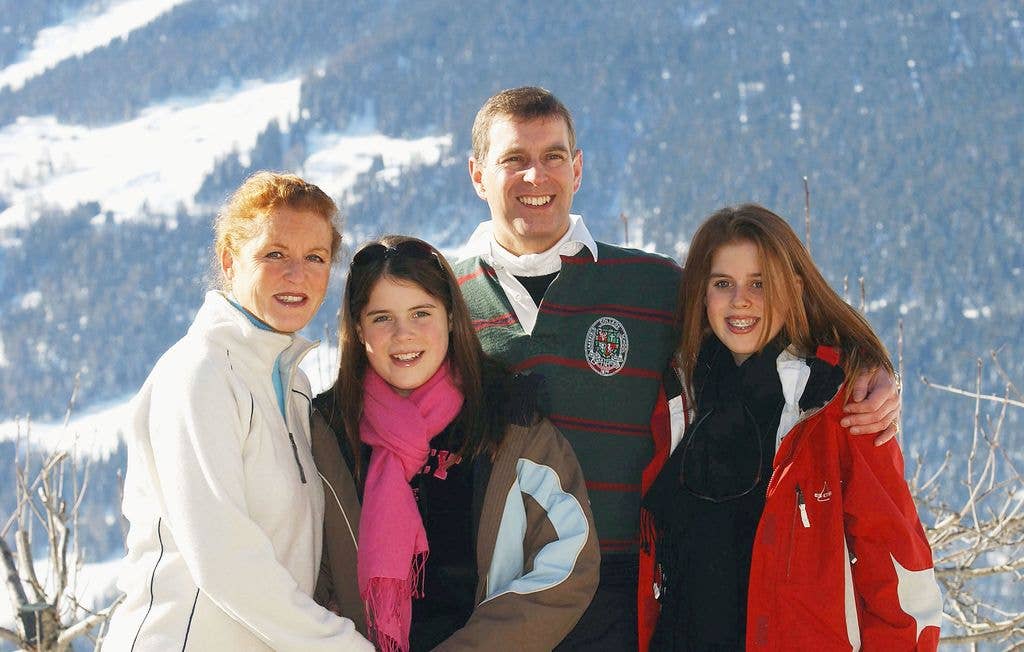 The Duchess of York, Princess Eugenie, the Duke of York and Princess Beatrice attend a photocall on February 18, 2003 in Verbier, Switzerland, and are shown against the Swiss mountains.