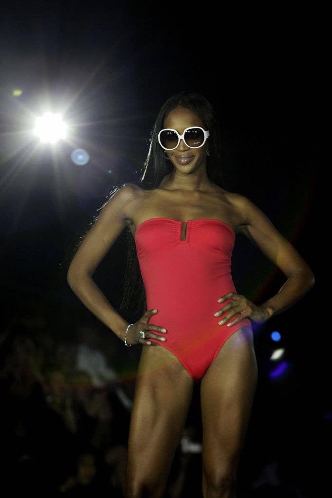 Naomi Campbell in red strapless swimsuit