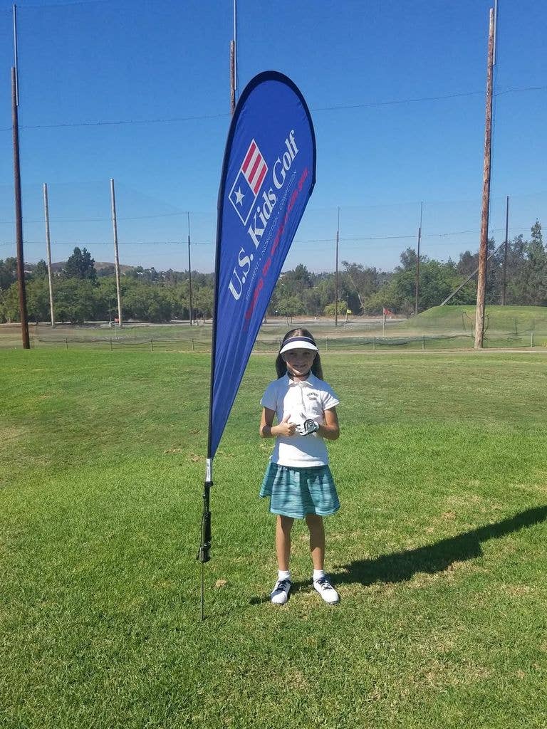 Bailey as a kid at a golf tournament 