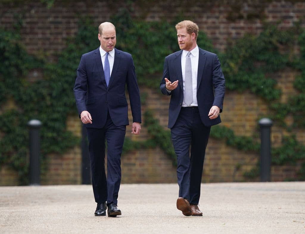  Prince William, Duke of Cambridge (left) and Prince Harry, Duke of Sussex arrive for the unveiling of a statue they commissioned of their mother Diana, Princess of Wales, in the Sunken Garden at Kensington Palace, on what would have been her 60th birthday on July 1, 2021 in London, England. Today would have been the 60th birthday of Princess Diana, who died in 1997