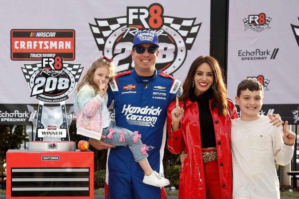 Kyle Busch, driver of the #7 HendrickCars.com Chevrolet, celebrates with daughter Lennix, son Brexton, and wife Samantha in victory lane after winning the NASCAR Craftsman Truck Series Fr8 Racing 208 at Echo Park Speedway on February 21, 2026 in Hampton, Georgia. (Photo by Sean Gardner/Getty Images)