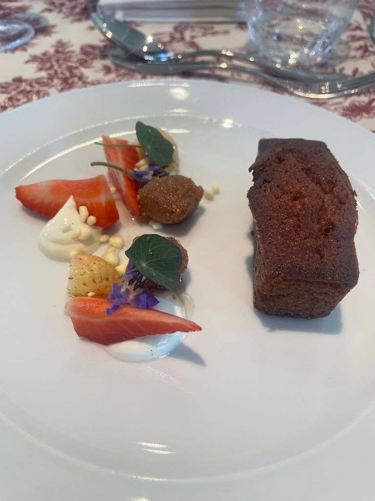 The dessert was honey cake with macerated strawberries and hung yoghurt