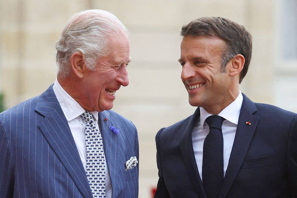 The King and French President Emmanuel Macron traded laughs at Élysée Palace in 2023.