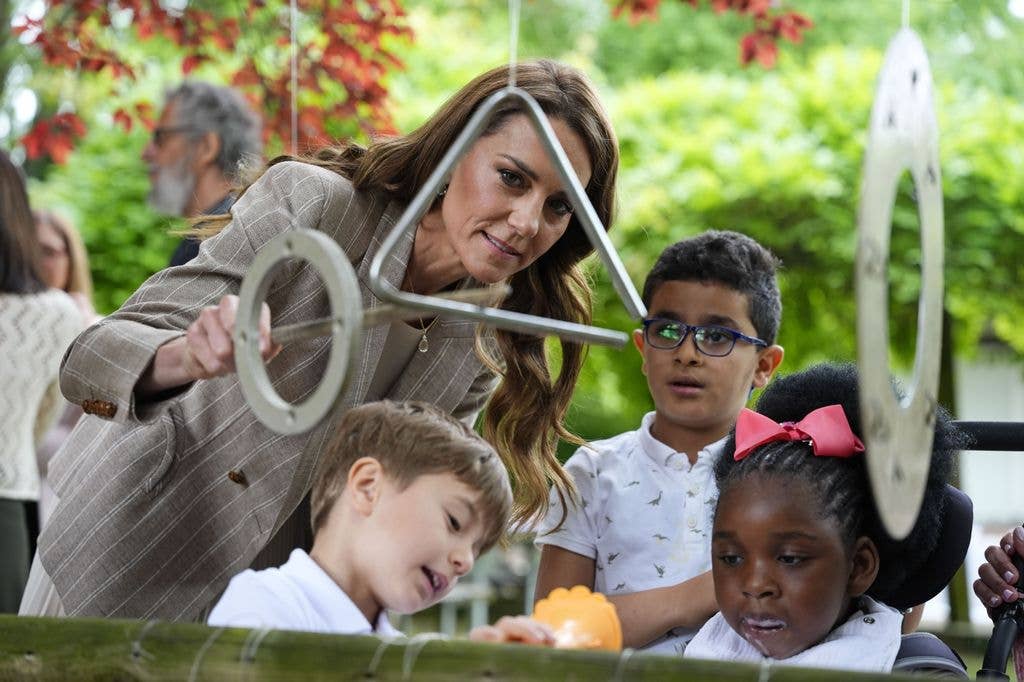 princess kate playing chimes on a tree