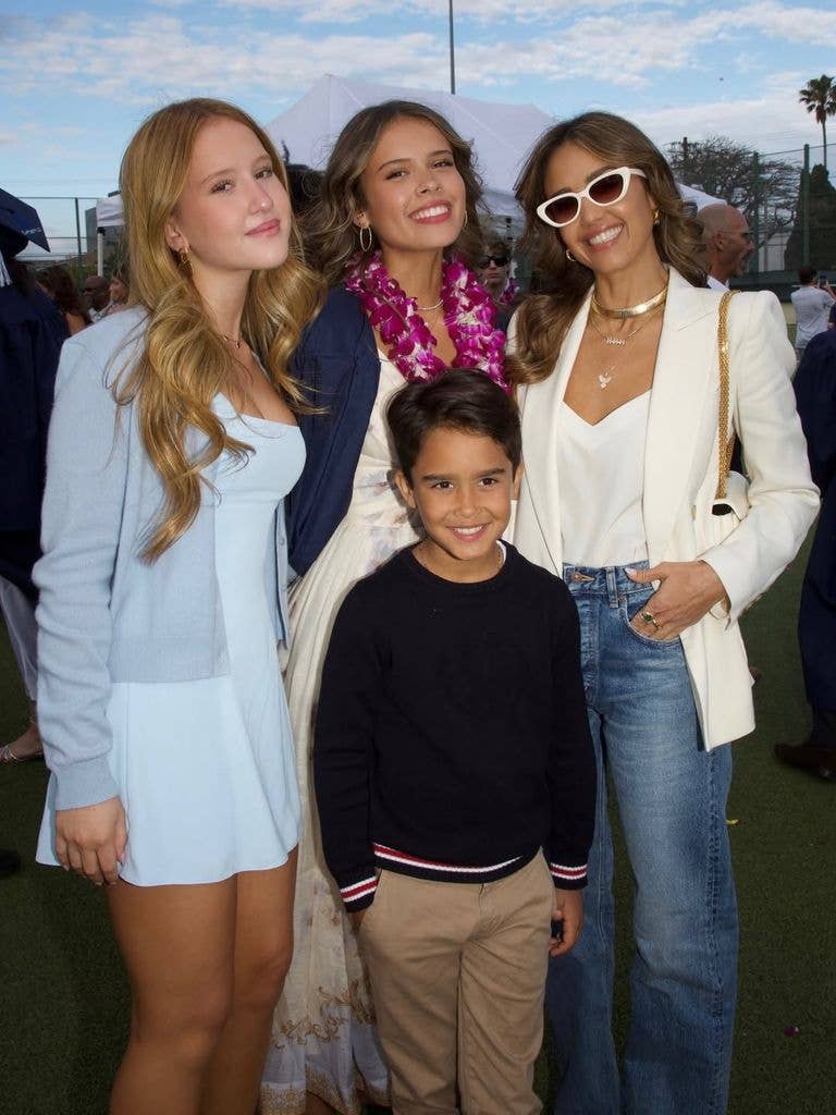 Jessica posed proudly with her three children