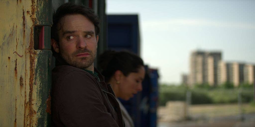 Charlie Cox and a woman in a still from Treason