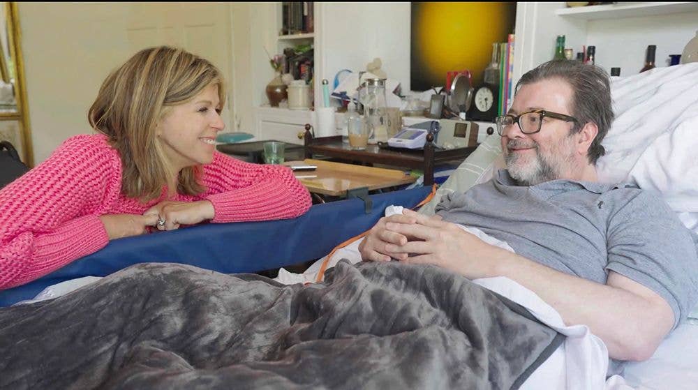 Kate Garraway sitting at Derek Draper's bedside as they chat