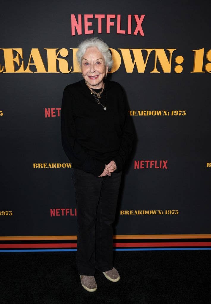 Michael Learned in black trousers and a black jumper at the special screening of Breakdown: 1975. 