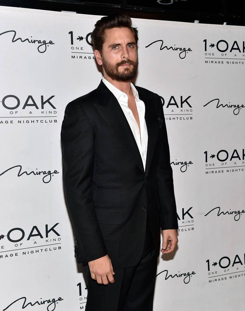 Scott Disick with full beard wearing a suit